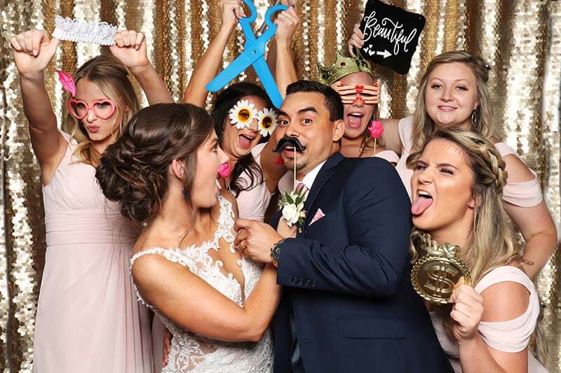 wedding brides strike a pose in a snap me crazy photo booth in oklahoma city,  Book your wedding today.