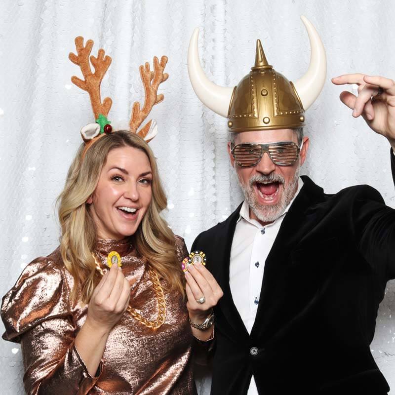 Moment Captured Couple play it up to the photo booth camera. Capturing a fun and memorable moment.
