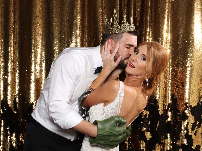dynamic_wedding_pose A bride reacts to being kissed in a wedding photo booth in Edmond.