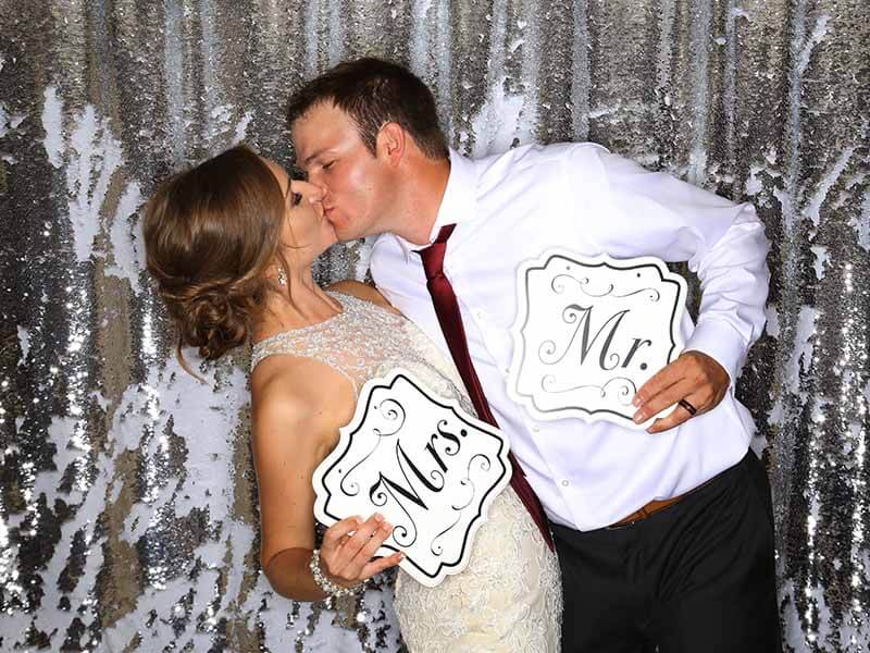 Groom kisses bride with passion at a wedding in Oklahoma.