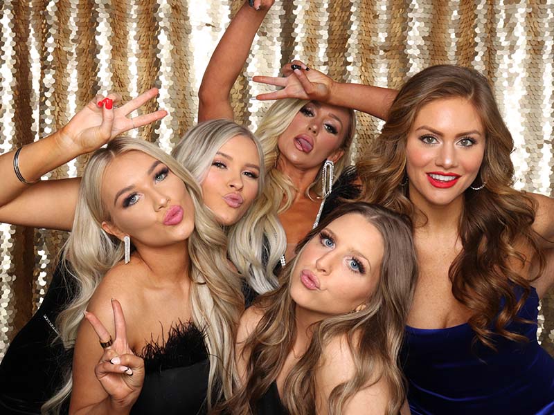models_Booth_pose Ladies pose like models inside a photo booth in downtown OKC.