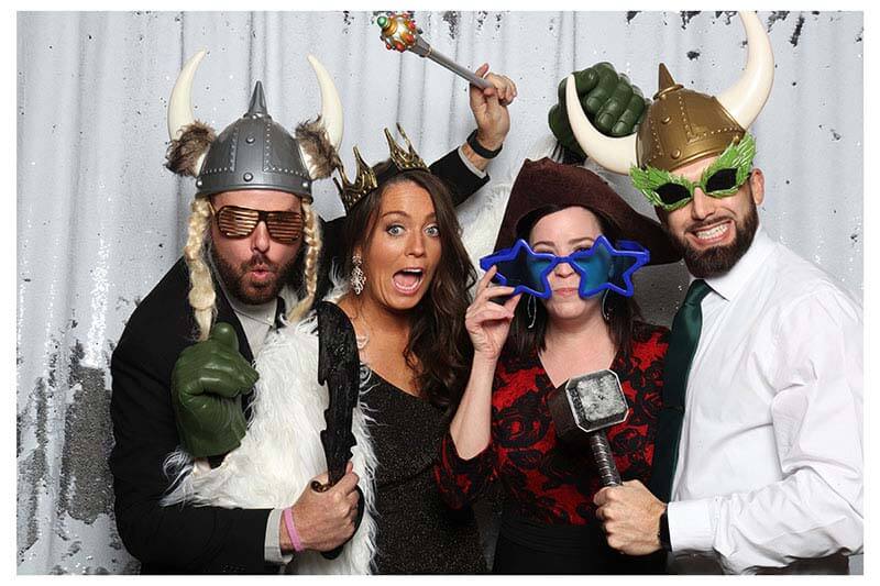 photobooth_at_okcevent photo booth attendant laughing with guests as they have their pictures snapped in our snap me crazy photobooth in edmond, oklahoma.