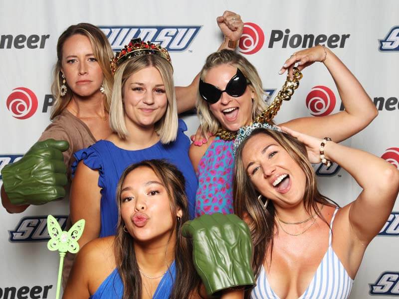 Kids having fun on prom night in a Snap Me Crazy Photo Booth at an OKC high school prom.