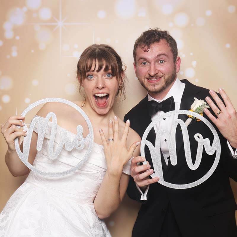 wedding_rings A happy and excited wedding couple hold up their rings at a wedding in Oklahoma.